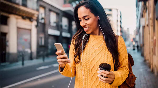 Person holding phone in one hand and scrolling with the thumb