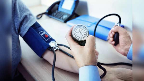 Doctor checking a patient's blood pressure